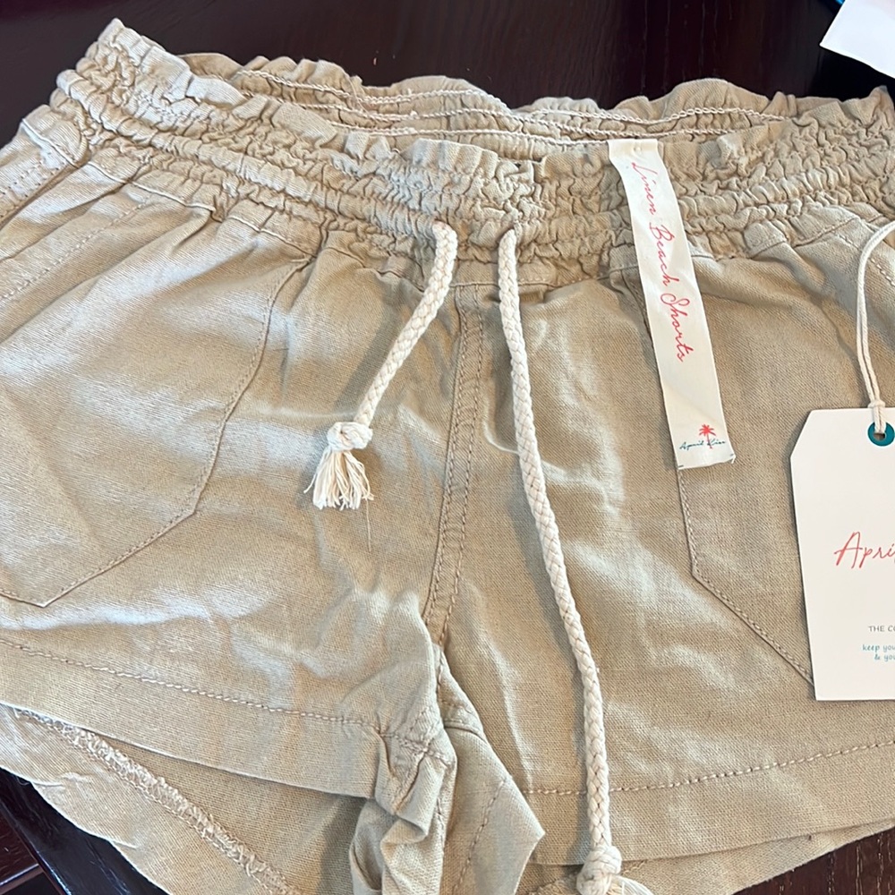 Lightweight tan linen shorts.